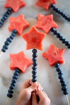 someone is holding up some candy stars to make them look like they are made out of gum