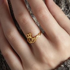 "♥ The ring is made from solid .925 Sterling silver. You can choose to plate (coat) the items with yellow gold or rose gold, free of charge. ♥ Letter size: Dainty, short letters are around 0.1 inch (3mm), tall letters around 0.2 inch (6mm) --HOW TO ORDER AND SEND US INSTRUCTION FOR PERSONALIZATION-- ♥ Go to the listing, add the item to cart and check out. During check-out, include in the \"Note to Seller\" box: Name on ring 1: Size ring 1 Name on ring 2: Size ring 2: Name on ring 3: Size ring 3: Minimalist Gold Rings With Custom Name, Custom Name Yellow Gold Promise Ring, Personalized Gold Sterling Silver Ring, Fine Jewelry Gold Rings With Name Detail, Gold Promise Ring With Name, Gold Promise Ring With Name Detail, Gold Rings In Fine Jewelry Style, Gold Stackable Rings With Name In Sterling Silver, Dainty Gold Ring With Custom Name