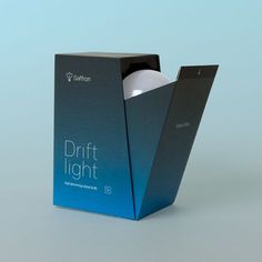 an open box with a light inside on a blue background that has the words drift light in it