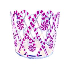 a pink and white cup with candy canes on the inside, in front of a white background