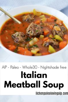 italian meatball soup in a white bowl with a spoon