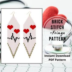 a pair of earrings with red hearts on them next to a stethoscope