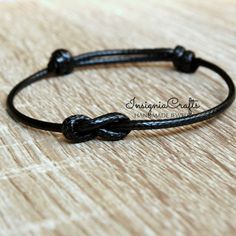 Mens Bracelet Infinity Bracelet Black Cord Bracelet Simple Bracelet Minimalist Bracelet Unisex Bracelet Vegan Cord Mens Friendship Bracelet These lovely bracelet is made with waxed cord. Easily adjustable by moving the knots closer or away. It opens from around 5'' to 10 '' inches. This bracelet will be sent in a gift pouch. Please feel free to contact me if you have any questions. For more Simple Anklets/Bracelets https://www.etsy.com/uk/shop/InsigniaCrafts?ref=seller-platform-mcnav&section_id=24106049 Thank you for visiting. InsigniaCrafts © 2018 InsigniaCrafts. All Rights Reserved. Mens Friendship Bracelet, Long Distance Relationship Bracelets, Distance Bracelet, Relationship Bracelets, Distance Bracelets, Family Bracelets, Mens Cross Necklace, Couples Bracelet, Red String Bracelet