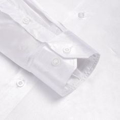 The White Silk Dress Shirt is a must-have for any stylish wardrobe. Made from premium quality silk, it feels luxurious against the skin and drapes beautifully, providing a sleek and sophisticated look. The classic white color of this shirt makes it versatile and easy to pair with any suit or tie, making it perfect for any formal or professional occasion. It has a button-up front and a traditional point collar, lending a timeless feel to the design. The material is breathable and lightweight, and Stylish Buttons, White Silk Dress, Christmas Dance, Party Business, Silk Shirt Dress, Fathers Day Sale, Fitted Dress Shirts, White Solid, White Silk