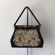 "This Beautiful Black Hand Beaded Tapestry Evening Bag is in excellent vintage condition. There are no rips, stains, missing beads, or unpleasant odors. This bag is simply stunning. It was hand beaded in Hong Kong. It measures approximately: Length: 8.0\" Height: 5.5\" Depth: 1.5\" Strap drop: 4.0\" It is rare to find a hand beaded vintage bag in this condition. Don't hesitate, this one is a beauty It will ship from a smoke and pet free environment." Handmade Tapestry Bags For Evening, Handmade Tapestry Evening Bags, Vintage Tapestry Shoulder Bag For Evening, Vintage Beaded Shoulder Bag For Everyday Use, Vintage Embellished Evening Bag, Beaded Tapestry, Vintage Black Embellished Bags, Vintage Beaded Formal Bags, Vintage Beaded Shoulder Bag