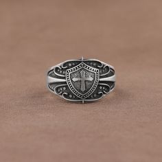 Silver Christian Symbol Cross on Shield Signet Ring,  925 Sterling Silver Religious Mens Ring, Unique Catholic Jewelry, Crusader Ring ✅ Handcrafted with love and joy, this ring will be with you for years to come, possibly even taking its place as a family heirloom for generations to come!  ✅ With its detailed handmade engravings, this silver ring will catch some serious attention and make a beautiful gift for your beloved ones. ✅ It's very elegant and classy for everyday use but also can be pref Silver Heirloom Signet Ring Tarnish Resistant, Heirloom Silver Tarnish-resistant Signet Ring, Christian Symbols, Catholic Jewelry, Mens Ring, Ring Unique, Family Heirloom, Drink Recipes, Signet Ring