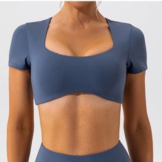 This crop top offers a snug fit that moves with your body, providing the ultimate comfort during intense workouts or casual jogs. The moisture-wicking material keeps you dry, while the stretchable fabric ensures a full range of motion, allowing you to focus on your fitness goals without any distractions. SPECIFICATIONS Product Material: Active Shirt Tops Feature: Breathable The Craft of Weaving: Knitted Square Crop Top, Women Active Wear, Top Run, Bra Crafts, Slim Fit Crop Top, Gorgeous Prom Dresses, Goth Grunge, Yoga Shirt, Activewear Sets