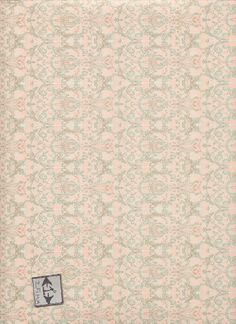 a pink and green wallpaper with an ornate design on it's side,