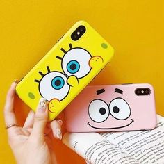 someone is holding up their phone case with the cartoon character face on it, while they both are next to each other