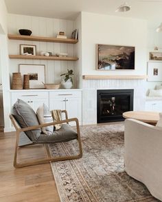 a living room filled with furniture and a fire place