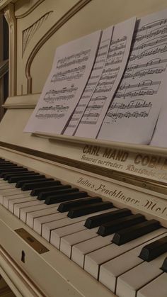 an old piano with sheet music on it