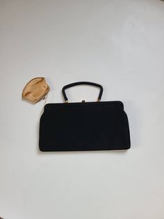 Good vintage condition Black matte satin like exterior Gold interior Gold coin purse attached 11 x 6 Formal Black Coin Purse, Black Evening Coin Purse, Retro Black Bags With Gold-tone Hardware, Vintage Black Bag With Snap Closure, Vintage Black Rectangular Coin Purse, Gold Handbags, Gold Interior, Matte Satin, Black Purses