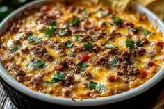 Meaty Texas Trash Dip Trash Dip Texas, Hearty Dips For A Crowd, Meaty Texas Trash Dip, Texas Trash Dip Recipe, Trash Dip Recipe, Hearty Appetizers, Hot Taco Dip, Texas Trash Dip, Meaty Meals