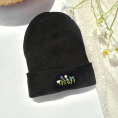 This cozy hat is a great accessory for your fall and winter wardrobe. It is very soft and comfortable with delicate flowers to keep you warm All my items are handmade in my studio in Israel & are never mass-produced whether buying it for yourself or as a gift, it is a unique gift like no other. One Size - However, because our accessories are hand made no two are exactly alike. The embroidery design is stitched directly onto the hat. Embroidery On Black, Cozy Hat, Black Beanie, Cotton Hat, Hat For Man, Delicate Flower, Beautiful Patterns, Stay Warm, Blue Flowers