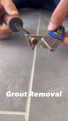 a person using a grout removal tool on a tile floor with the words grout removal above it