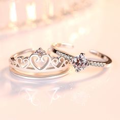 two wedding rings with tiaras on them