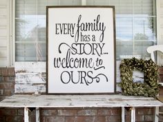 a sign that says every family has a story welcome to ourss on the front porch