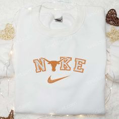 Texas Longhorns x Nike Embroidered Shirt, NCAA Sports Embroidered Hoodie, Best Gift Idea White Hoodie With Embroidered Graphics For Fall, Casual College Hoodie With Custom Embroidery, White Sweatshirt With Embroidered Sports Graphics, White Sweatshirt With Embroidered Graphics For Sports, White Embroidered Sweatshirt For Sports Season, Embroidered College Sweatshirt For Sports Season, Embroidered Sweatshirt For College Sports Season, White Embroidered Collegiate Sweatshirt, White Sweatshirt With Machine Embroidery For Streetwear