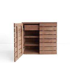 an open wooden cabinet with shelves and drawers on the bottom, in front of a white background