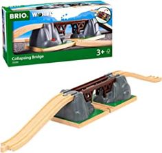 a wooden train set with tracks and accessories