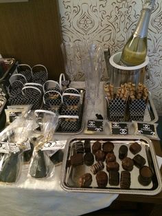 chocolates and champagne are on display at a party