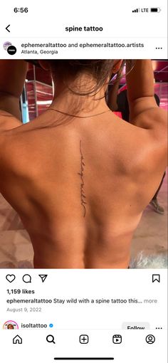 the back of a woman's neck with tattoos on her upper and lower back