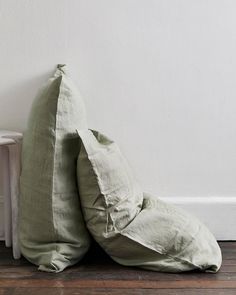 two pillows sitting next to each other on the floor