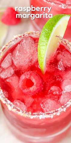 the raspberry margarita is garnished with lime