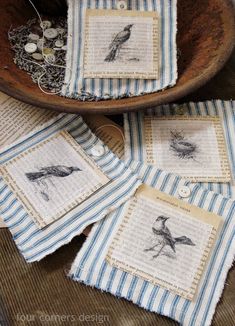 four birds on blue and white striped napkins in a bowl with beadwork