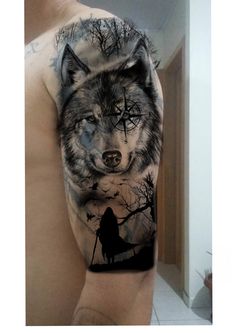 a man with a wolf tattoo on his arm