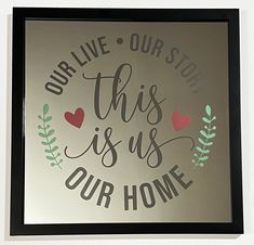 this is us our home sign with hearts and leaves in the center on a white wall