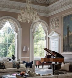 a living room filled with furniture and a grand piano