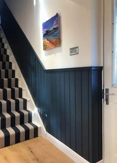 the stairs in this house are painted black and white