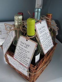 two bottles of wine in a wicker basket with tags attached to the top and bottom