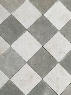 a white and grey checkered tile floor is shown