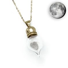 ***Unlike other vial pendants of this type, ours is made from 100% 9ct Solid Gold, not cheap metal*** ***FREE worldwide shipping!***Contains genuine moon dust, yes, actual certified dust from the Moon! This vial contains double the amount of moon dust than our sterling silver version.Real Moon Dust Necklace (NWA 3163)About Your Meteorite Pendant: - Approx. weight of moon dust is 20mg - Attached to a beautiful 20-inch 9ct Gold Chain - Made using a Solid 9ct Gold Cap - Pendant measures approx. 2.8 Exploding Star, Lunar Meteorite, Meteorite Necklace, Space Necklace, Meteorite Jewelry, Meteorite Pendant, Gold Cap, Moon Dust, Gold Caps