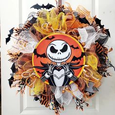 a halloween wreath with a skeleton on it