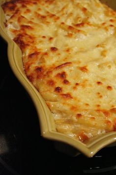 a cheesy dish is sitting on the stove