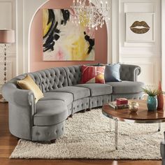 a living room filled with furniture and a chandelier