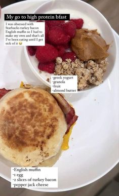 a white plate topped with breakfast foods on top of a table