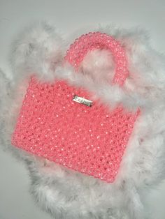 MODEL KNITKOS BAG- FLUFFY . Holds an iPhone smartphone, keys, headphones (and many small trinkets) . . #knitkos_bag . ▫️Material: Acrylic bead, fluff ▫️Size: 23 (with handles)/18sm/6sm ▫️The set includes a cast chain of 1 m ▫️Delivery anywhere in the world ▫️The price is $250 USD ▫️Repeat possible in any color . . . @beaded.bags @elleusa @elle @voguekorea @vogueitalia @vogue @voguemagazine @cosmopolitan #сумкаизбусин #жемчужнаясумка #сумкаизбисера #сумкаручнойработы #сумкакупить Pink Party Bag With Pearl Handle, Pink Beaded Shoulder Bag, Pink Beaded Party Shoulder Bag, Pink Beaded Shoulder Bag For Party, Pink Embellished Handheld Shoulder Bag, Pink Rectangular Shoulder Bag With Pearl Handle, Pink Embellished Shoulder Bag For Party, Pink Beaded Tote Bag, Pink Embellished Rectangular Evening Bag