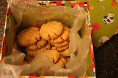 a box filled with cookies sitting on top of a table