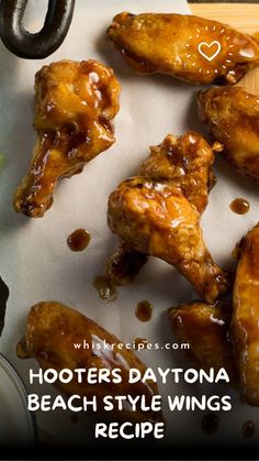 some chicken wings sitting on top of a cutting board