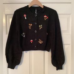 Dangerfield Mushroom Cardigan. Mushroom Embroidery. 5 Buttons. Please See Measurements In Pictures. Nwot. Please Let Me Know If You Have Questions. Mushroom Jacket, Mushroom Cardigan, Mushroom Sweater, Mushroom Embroidery, Floral Sweater, Clothing Inspiration, Eras Tour, Black Cardigan, Cottage Core