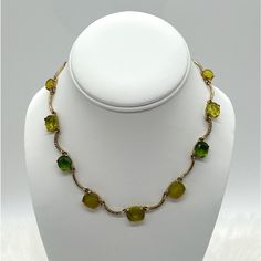 For Your Consideration Is A Vintage Trifari Necklace With Tags Still Attached! The Necklace Features Various Shades Of Green Glass On A Gold Tone Curved Bar Chain. There Are Also Links With Small Clear Crystals. The Necklace Measures 16 Inches With Lobster Clasp And 1 Inch Extender. Very Pretty! Green Glass Jewelry With Adjustable Chain, Green Glass Necklace For Party, Adjustable Glass Necklaces For Formal Occasions, Elegant Green Glass Necklaces, Adjustable Green Metal Necklaces, Trifari Jewelry, Curved Bar, Vintage Trifari, Clear Crystals