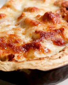 a pizza sitting on top of a pan covered in cheese