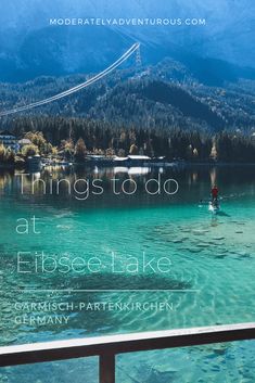 the cover of things to do at flossee lake in germany, with mountains in the background