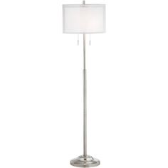 a floor lamp with a white shade on it