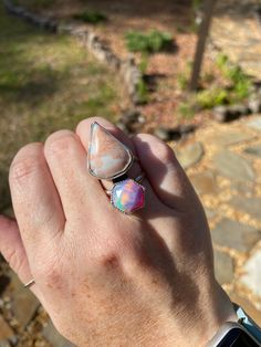 Gorgeous aurora Opal and agate ring. Double band. Size 7. All jewelry is handcrafted by me in my home studio in sunny Daytona Beach, FL! I use .925 Sterling silver & .999 Fine silver.  Perfectly imperfect and made with love. As with any handmade item, my pieces are not perfect and each has their own unique quirks. That's what makes each piece beautiful and one of a kind!  Sterling silver is prone to tarnish over time. Each order will receive a small polishing cloth to brighten and shine up jewelry as needed.  Follow me on Instagram: @silverbeejewelry Thank you so much for looking.  Please review each picture and let me know if you have any questions. Ring Double Band, Aurora Opal, Agate Ring, Daytona Beach, Perfectly Imperfect, Ring Sterling Silver, Fine Silver, Sterling Ring, Rings Statement