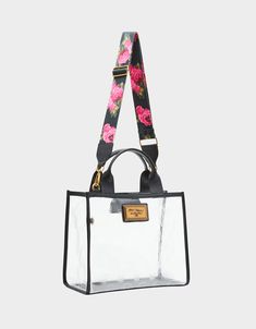 Carry your essentials in style with this SKULL BOSS MEDIUM CLEAR TOTE bag! Featuring an embossed skull print, this clear tote adds a touch of edginess to any outfit. Perfect for concerts, festivals, or everyday use, this bag is both functional and chic. Manmade materials 12"L x 5.5"D x 10.1"H Imported Clear Satchel Bag For Daily Use, Clear Top Handle Shoulder Bag For Everyday Use, Everyday Clear Rectangular Satchel, Modern Clear Satchel Bag, Modern Clear Tote Shoulder Bag, Casual Clear Bags For On-the-go, On-the-go Clear Tote Shoulder Bag, Clear Tote Bag For On-the-go, Black Bag With Clear Strap For On-the-go